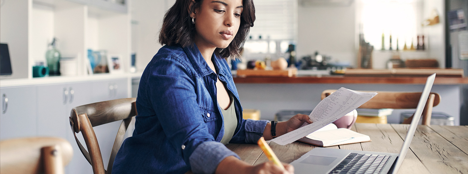 Lady using a laptop computer in her office